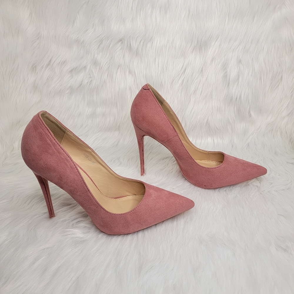 Pink suede pointed toe stiletto heels.